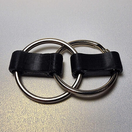 Two overlapping key rings with 3D printed connectors